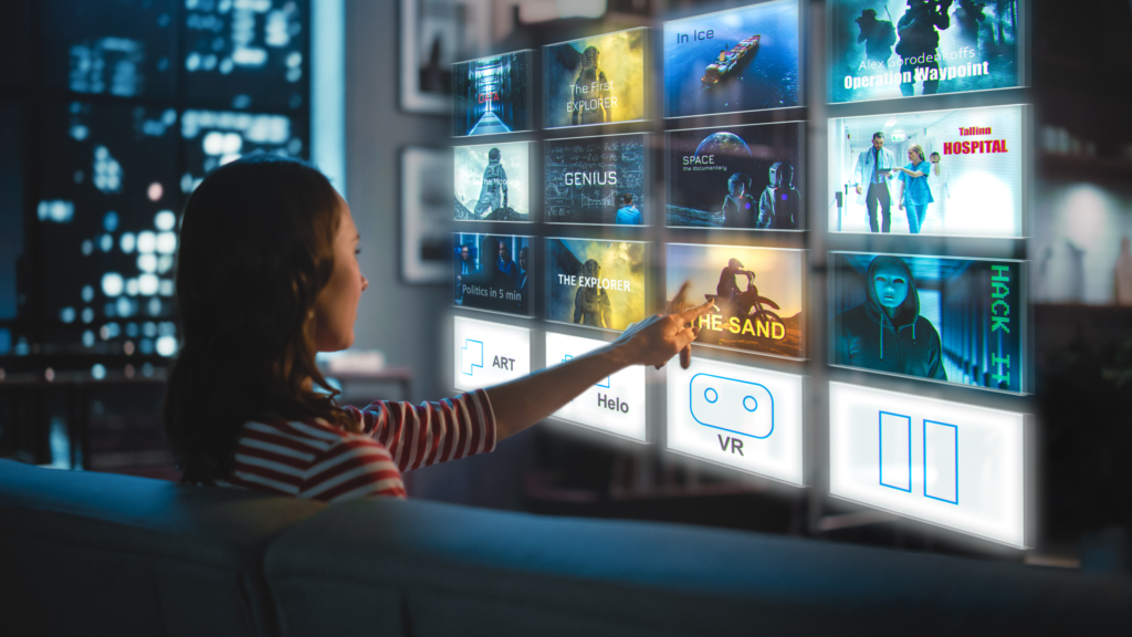 A woman streaming video sits on a couch and selects a tile from a floating video menu